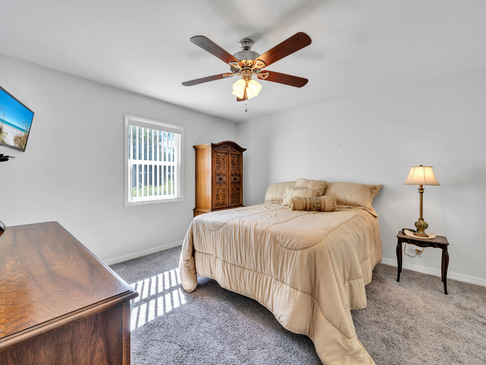 5346 Fox Hound Lane Baker, FL 32531 - Photo 19 of 46 a bedroom with a bed and a chandelier