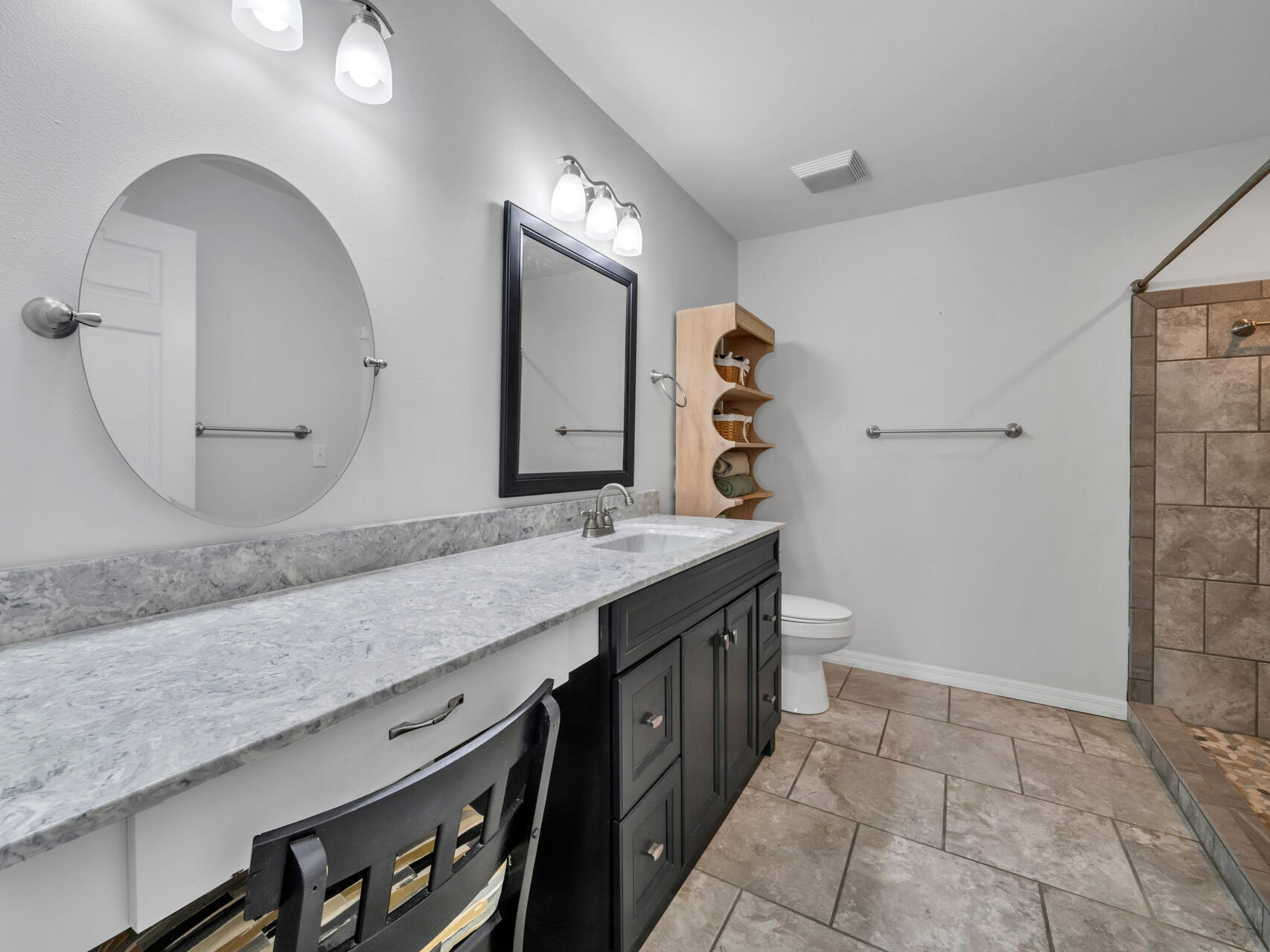 5346 Fox Hound Lane Baker, FL 32531 - Photo 21 of 46 a spacious bathroom with a granite countertop double vanity and a mirror