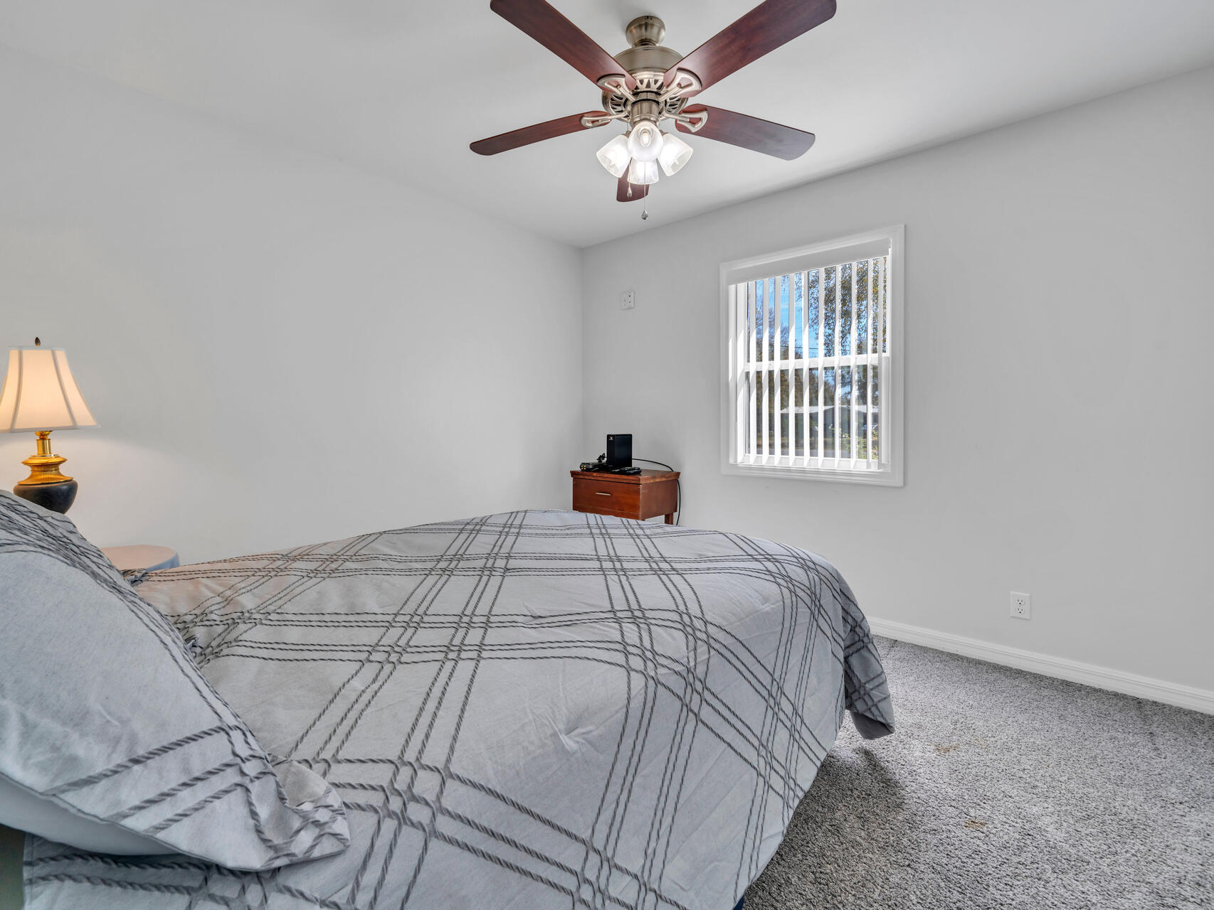 5346 Fox Hound Lane Baker, FL 32531 - Photo 23 of 46 a bedroom with a bed and a chandelier