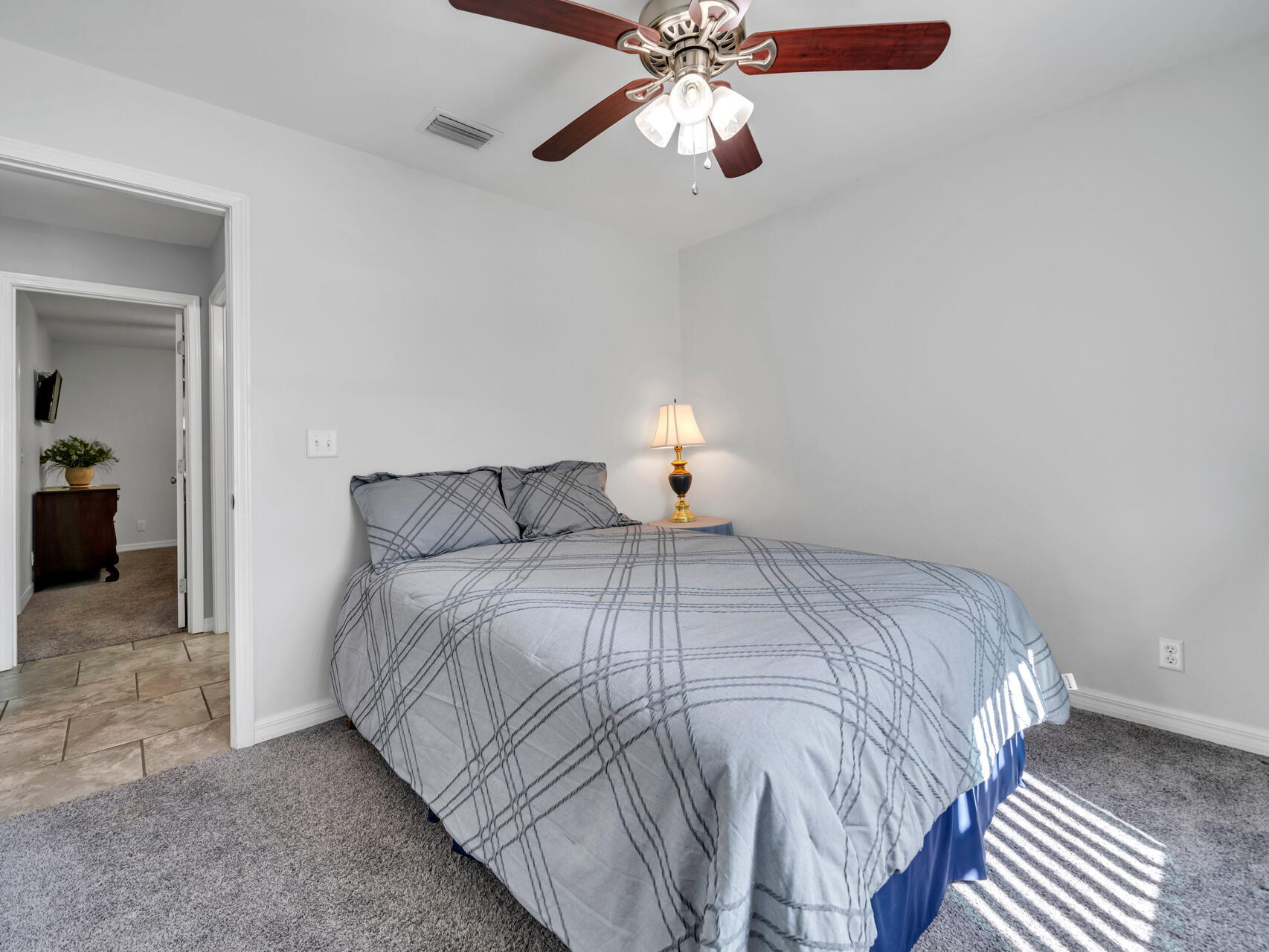 5346 Fox Hound Lane Baker, FL 32531 - Photo 24 of 46 a bedroom with a bed and a chandelier