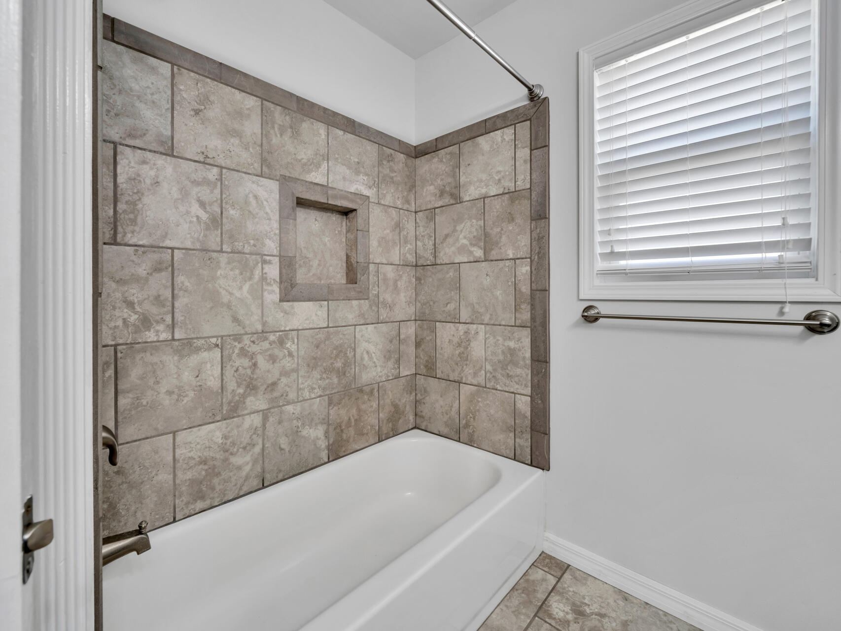 5346 Fox Hound Lane Baker, FL 32531 - Photo 26 of 46 a bathroom with a bathtub