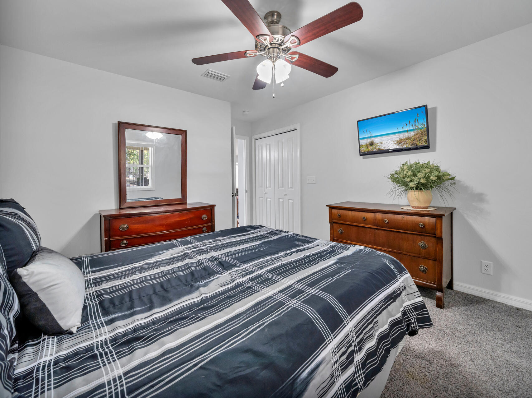 5346 Fox Hound Lane Baker, FL 32531 - Photo 28 of 46 a bedroom with bed and a chandelier
