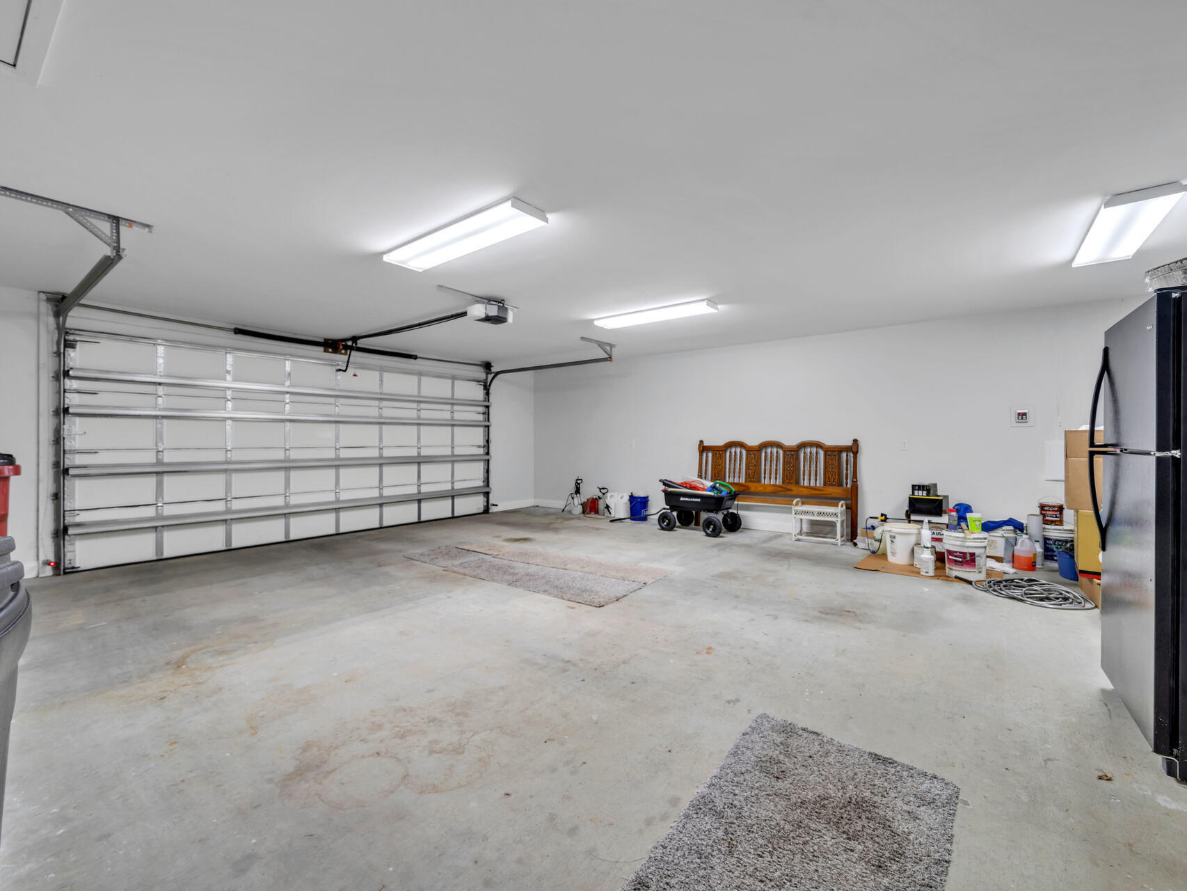 5346 Fox Hound Lane Baker, FL 32531 - Photo 31 of 46 a view of a garage with parked cars