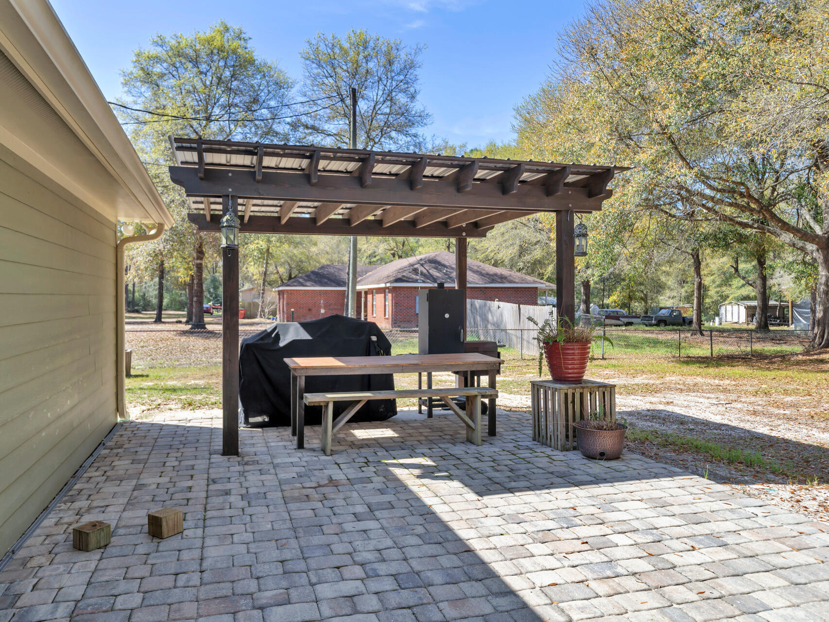 5346 Fox Hound Lane Baker, FL 32531 - Photo 33 of 46 a view of a swimming pool with a patio