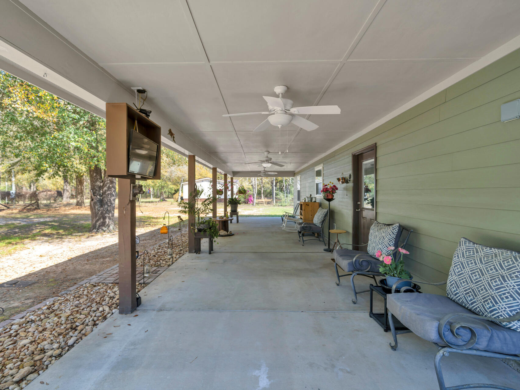 5346 Fox Hound Lane Baker, FL 32531 - Photo 36 of 46 a living room with furniture and a large window