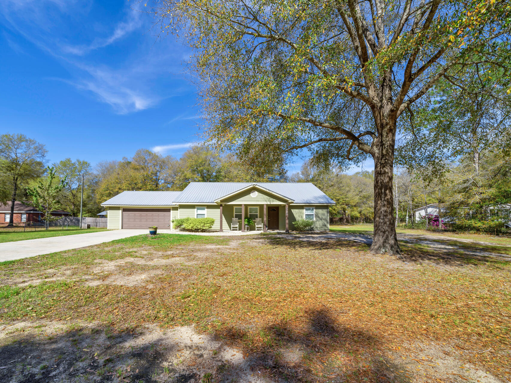 5346 Fox Hound Lane Baker, FL 32531 - Photo 4 of 46 a front view of a house with a yard
