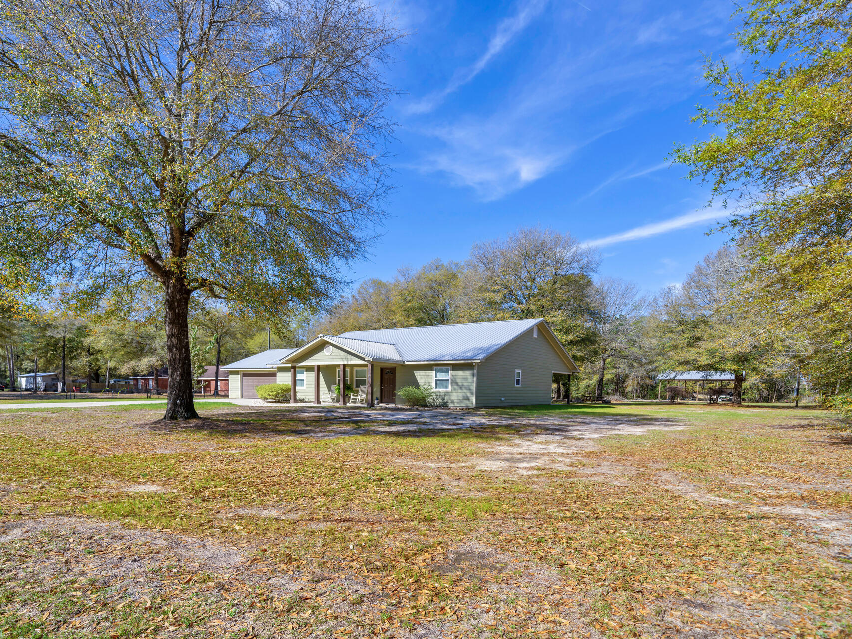 5346 Fox Hound Lane Baker, FL 32531 - Photo 41 of 46 a house view with a garden space