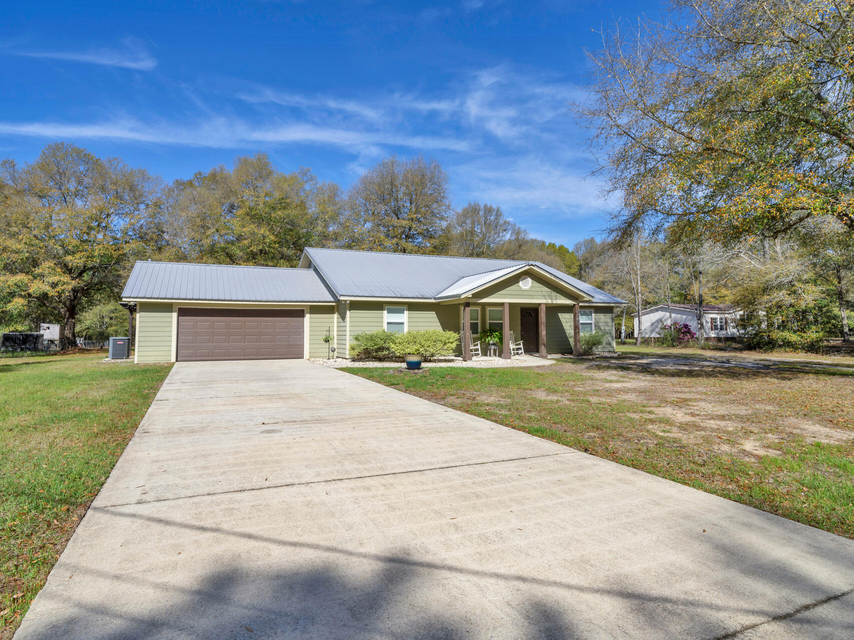 5346 Fox Hound Lane Baker, FL 32531 - Photo 5 of 46 a front view of a house with a yard