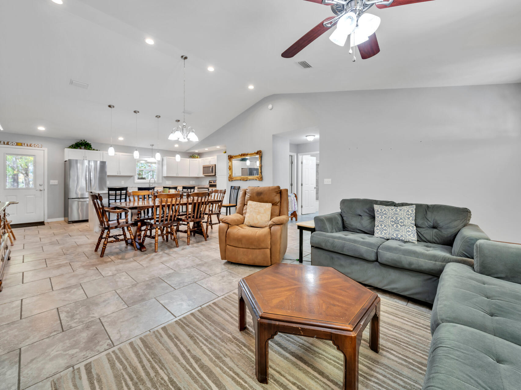 5346 Fox Hound Lane Baker, FL 32531 - Photo 9 of 46 a living room with furniture and kitchen view