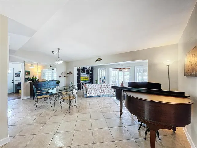 a room with dining table and chairs