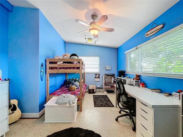 a view of a room with workspace and a window