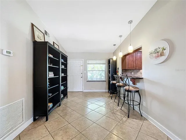 a view of room with furniture and windows