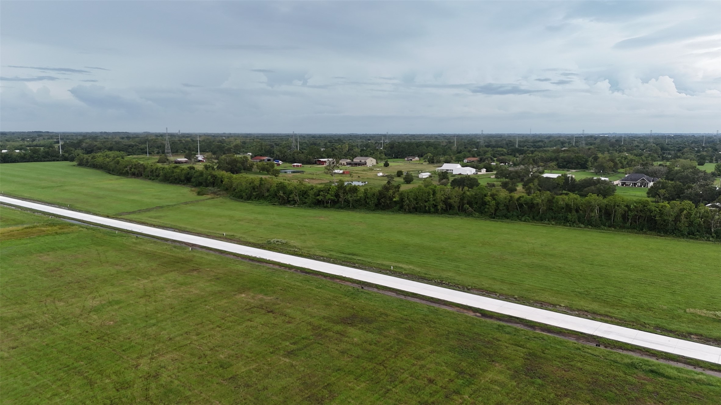 1719 Rymal Ranch Road Alvin, TX 77511 - Photo 2 of 6 a view of a golf course with a lake