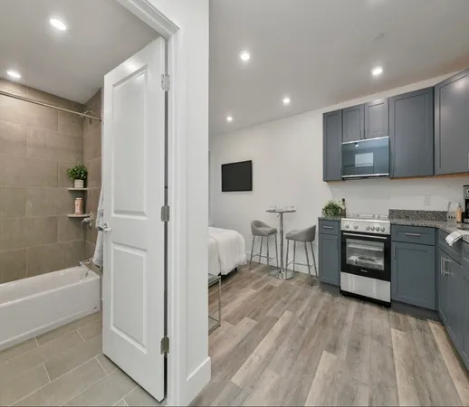 a bathroom with a sink a toilet and bathtub