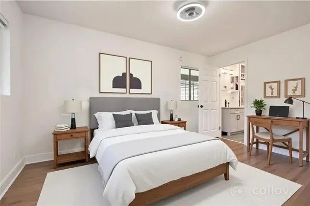 a bedroom with a bed and window