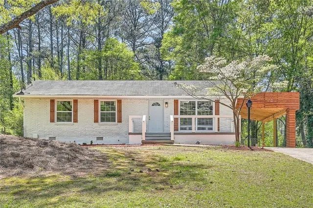 front view of a house with a yard