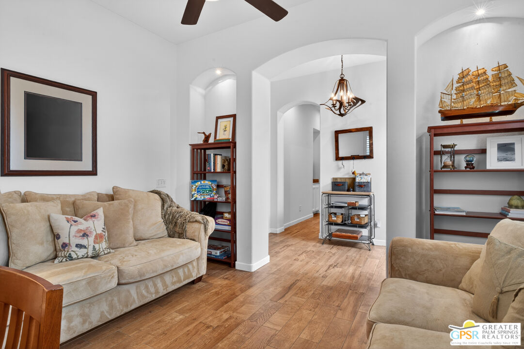 82717 Barrymore Street Indio, CA 92201 - Photo 11 of 26 a living room with furniture and a flat screen tv