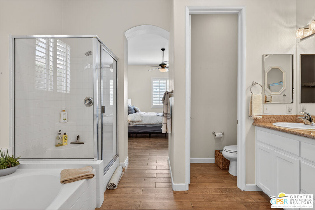 82717 Barrymore Street Indio, CA 92201 - Photo 15 of 26 a en suite bathroom with a sink a toilet and shower