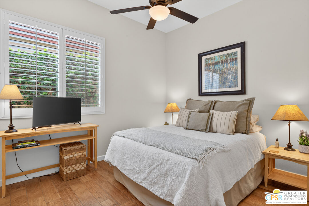 82717 Barrymore Street Indio, CA 92201 - Photo 16 of 26 a bedroom with a bed and a desk