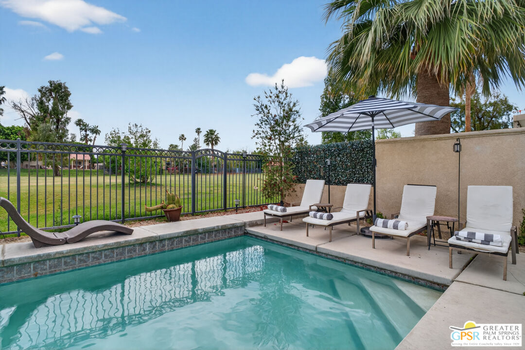 82717 Barrymore Street Indio, CA 92201 - Photo 19 of 26 a view of a chair and tables in the patio