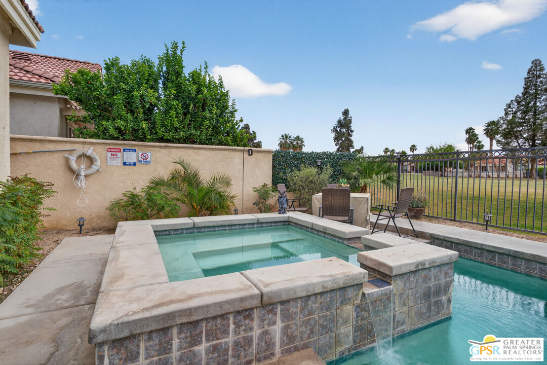 82717 Barrymore Street Indio, CA 92201 - Photo 20 of 26 a view of a patio with couches table and chairs and potted plants
