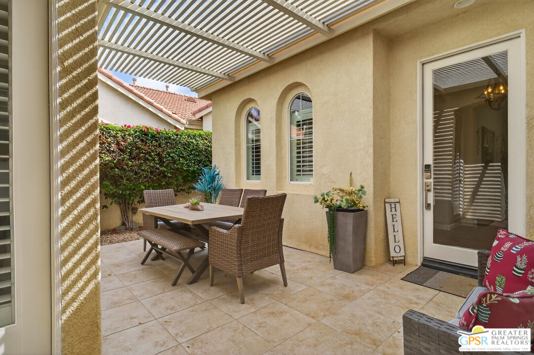 82717 Barrymore Street Indio, CA 92201 - Photo 3 of 26 a view of a house with backyard and sitting area