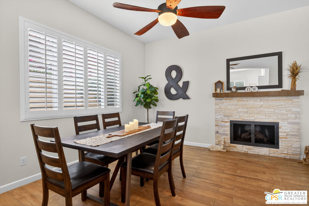 82717 Barrymore Street Indio, CA 92201 - Photo 8 of 26 a view of a dining room with furniture and a large window