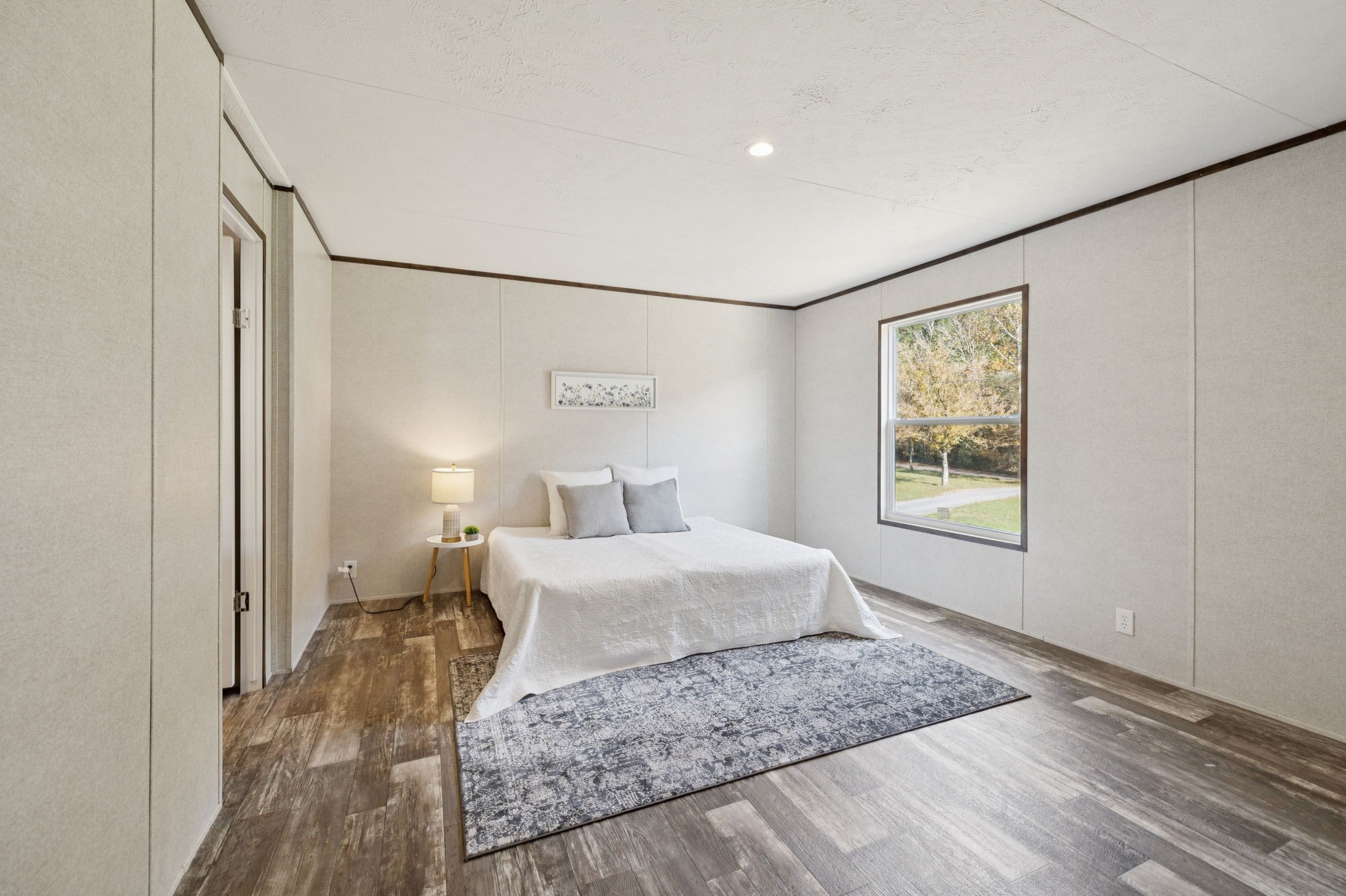 825 Gaulden Hollow Road Lafayette, TN 37083 - Photo 25 of 51 a bedroom with a bed and a window