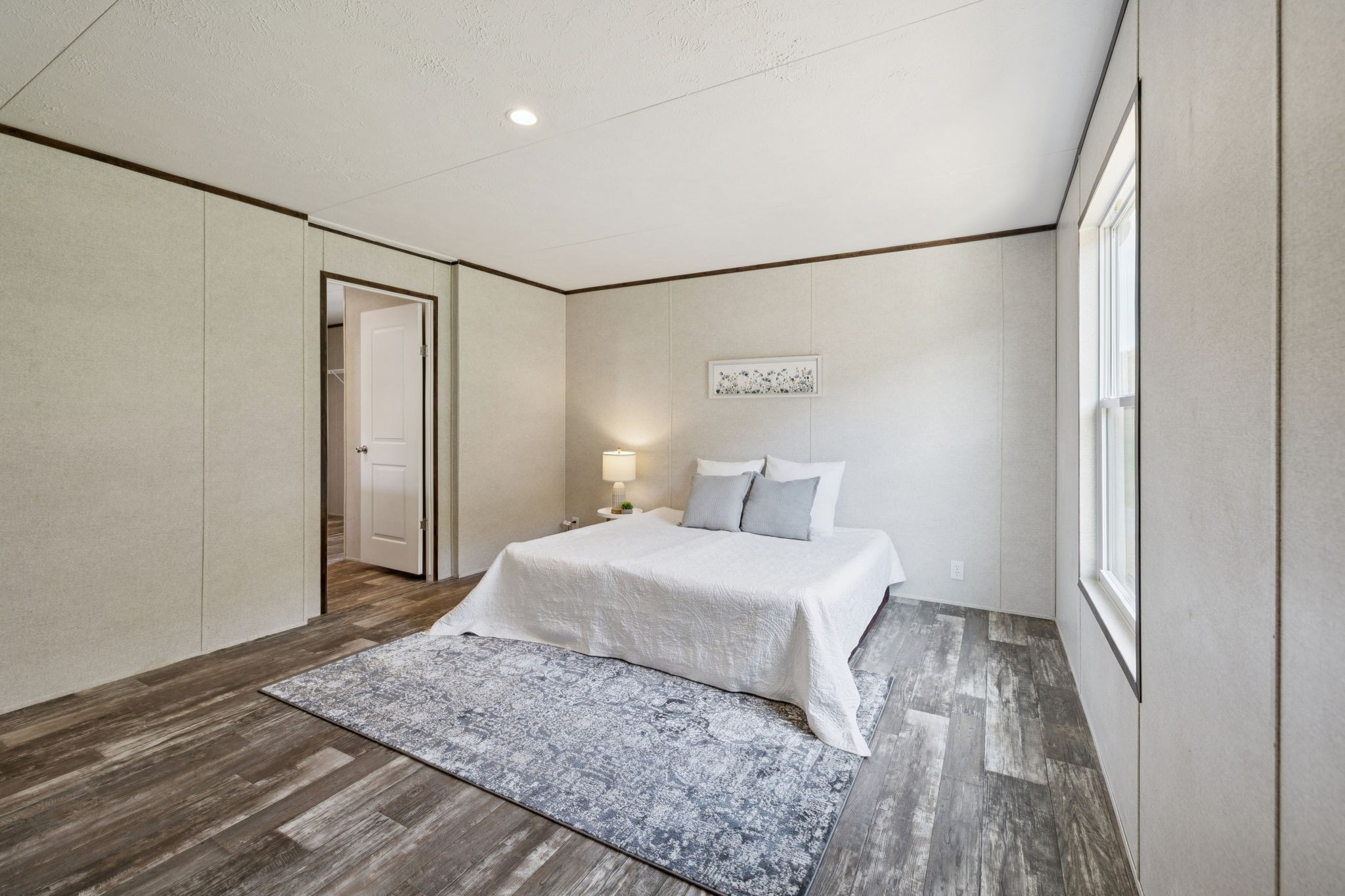 825 Gaulden Hollow Road Lafayette, TN 37083 - Photo 26 of 51 a bedroom with a bed and a mirror