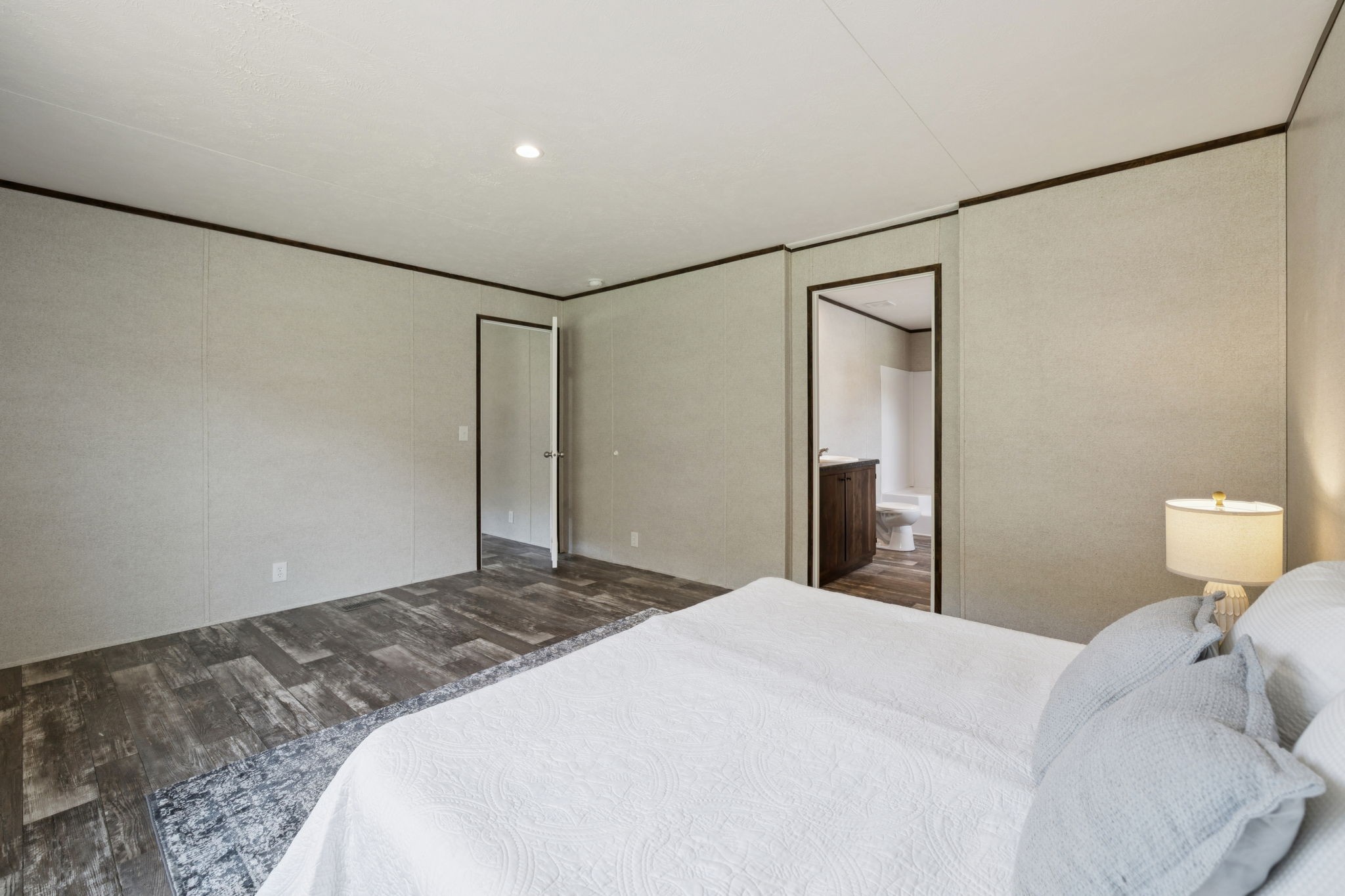 825 Gaulden Hollow Road Lafayette, TN 37083 - Photo 27 of 51 a bedroom with a bed and a chandelier