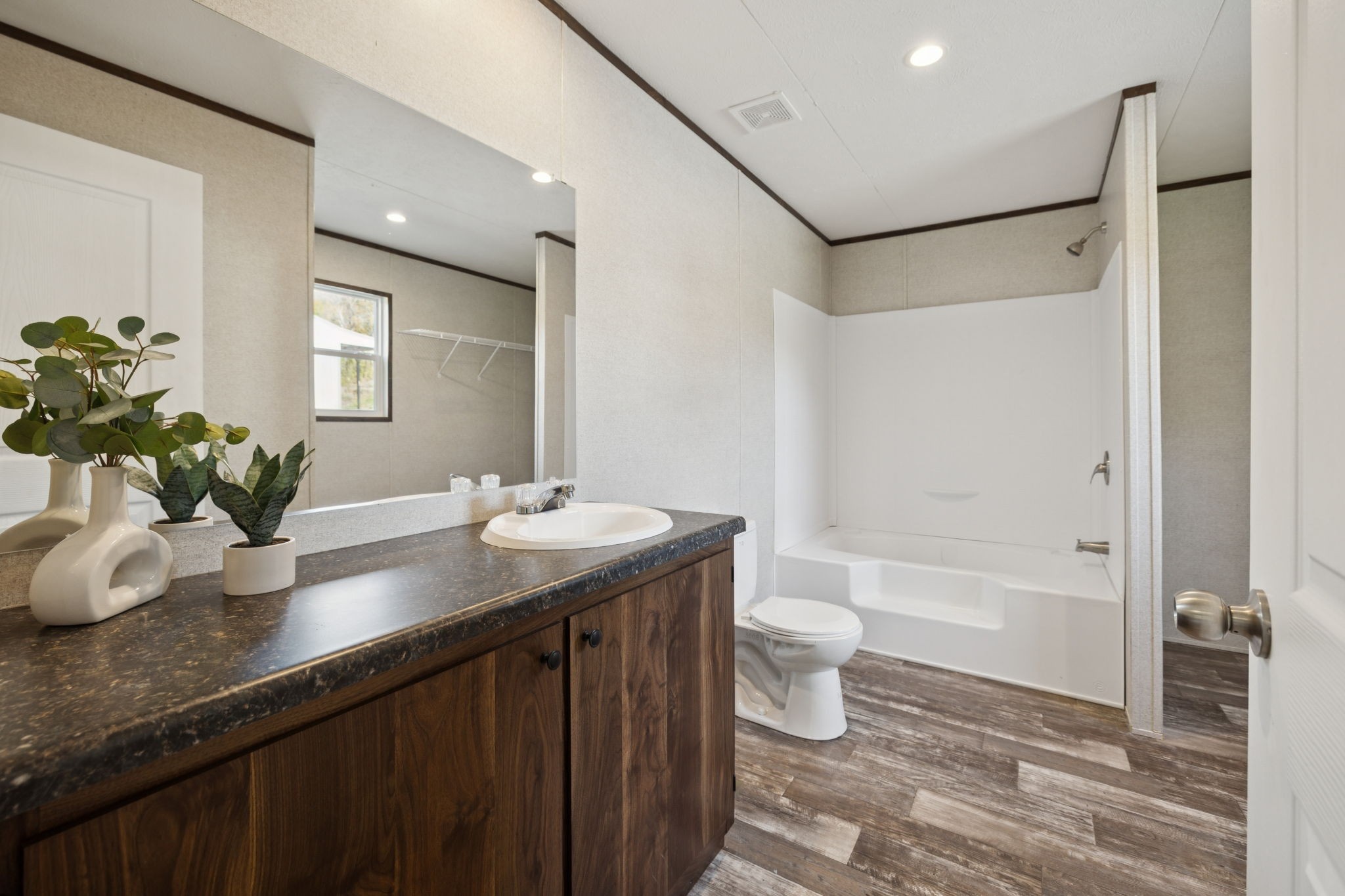 825 Gaulden Hollow Road Lafayette, TN 37083 - Photo 28 of 51 a bathroom with a granite countertop sink a toilet and shower