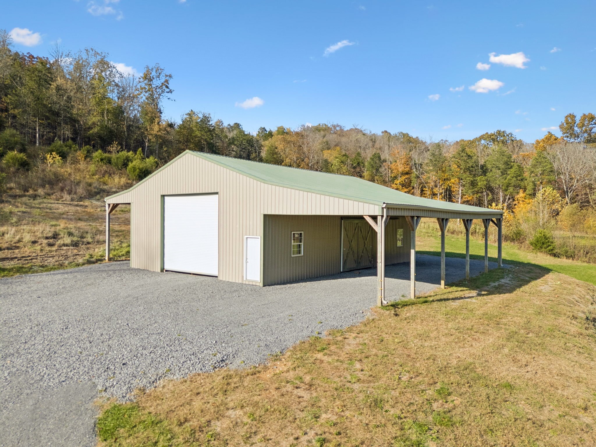 825 Gaulden Hollow Road Lafayette, TN 37083 - Photo 42 of 51 a view of a house with a backyard and mountain view