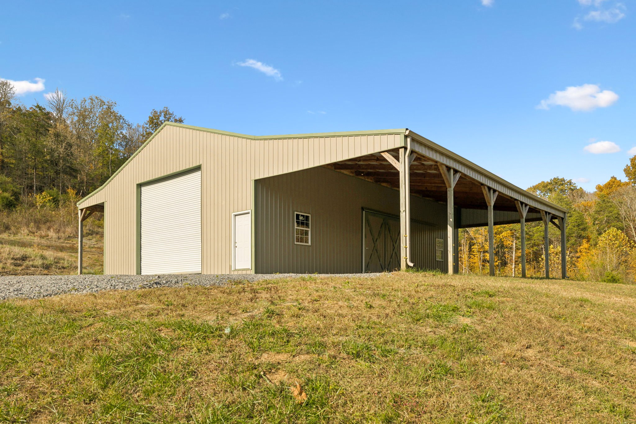 825 Gaulden Hollow Road Lafayette, TN 37083 - Photo 43 of 51 a front view of a house with a garden