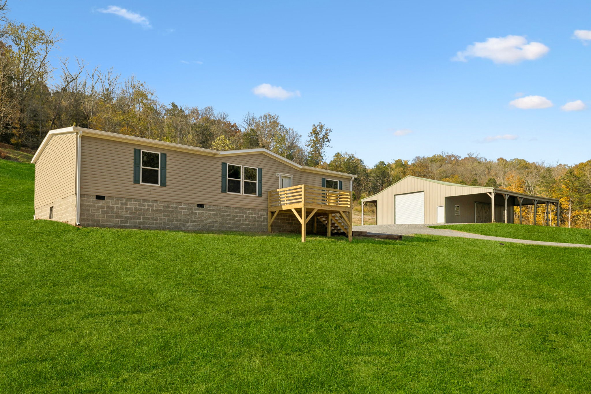 825 Gaulden Hollow Road Lafayette, TN 37083 - Photo 10 of 51 a front view of a house with a garden