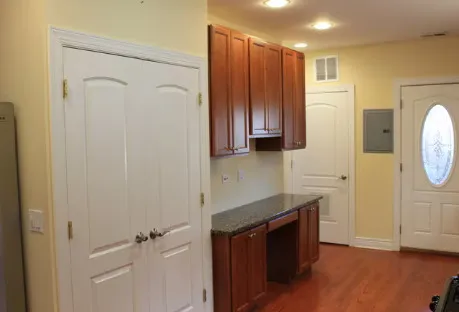 a kitchen with stainless steel appliances a refrigerator and cabinets