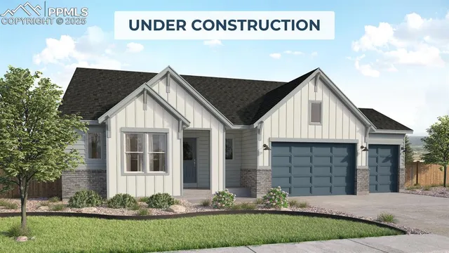 a view of a white house next to a yard