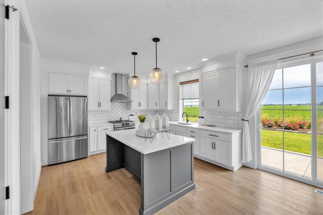 908 Declaration Drive Savoy, IL 61874 - Photo 41 of 41 a kitchen with counter top space sink and refrigerator
