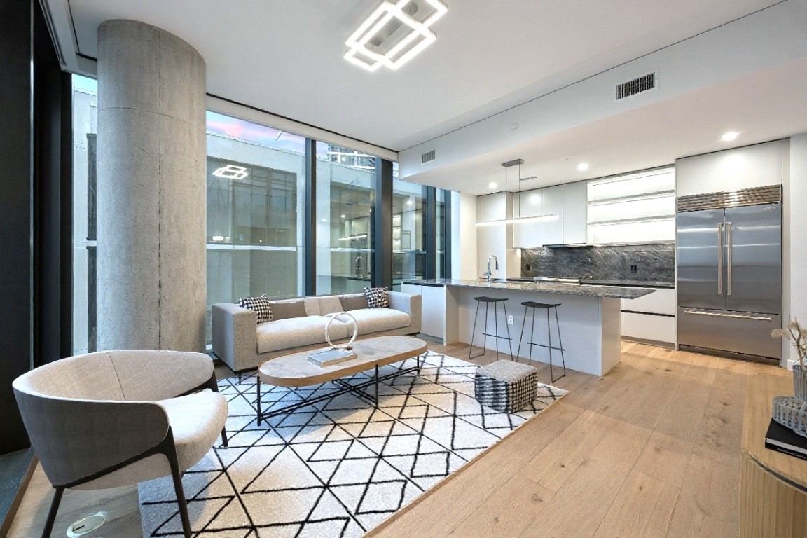 610 Davis Street, Unit 3005 Austin, TX 78701 - Photo 1 of 24 a living room with furniture and a large window