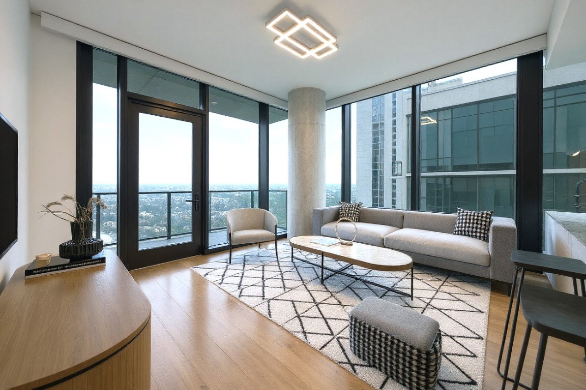 610 Davis Street, Unit 3005 Austin, TX 78701 - Photo 2 of 24 a living room with furniture and a large window