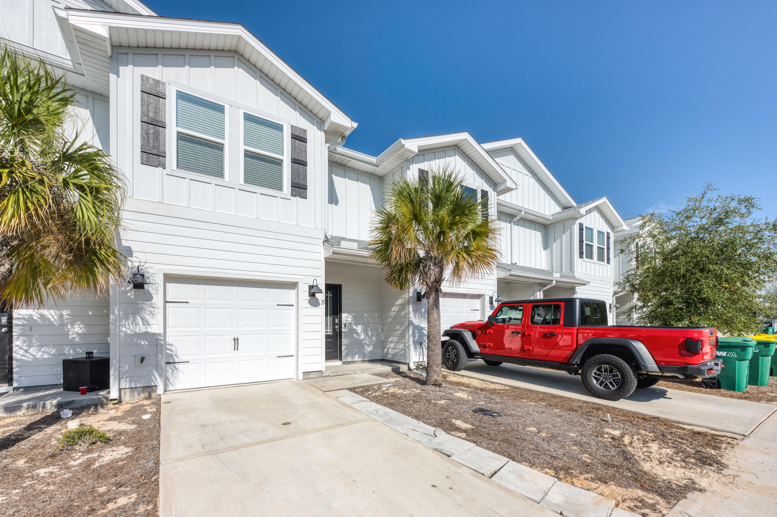 15 Redbird Loop Destin, FL 32541 - Photo 2 of 42 a building with trees in front of it