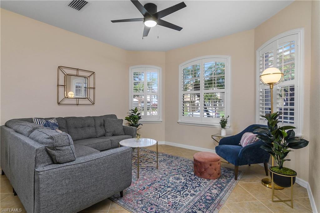 12454 Rock Ridge Lane Fort Myers, FL 33913 - Photo 11 of 37 a living room with furniture and a potted plant