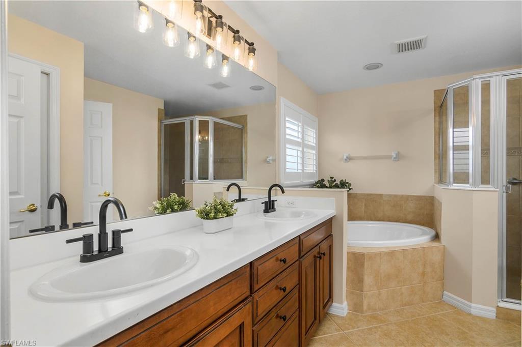 12454 Rock Ridge Lane Fort Myers, FL 33913 - Photo 16 of 37 a bathroom with a sink double vanity
