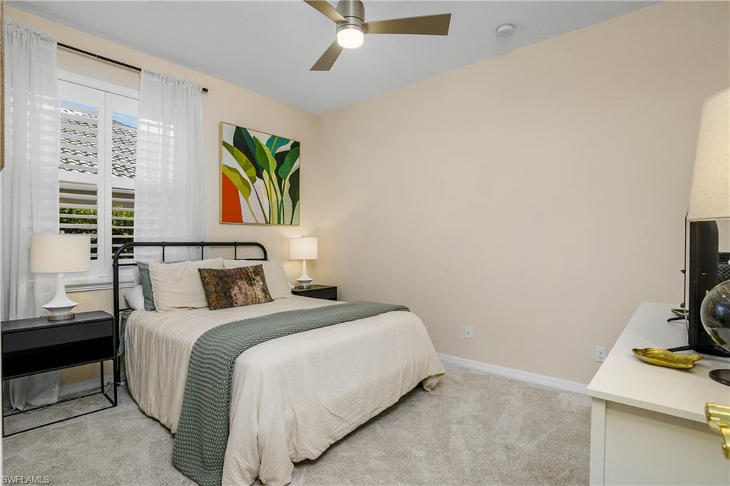 12454 Rock Ridge Lane Fort Myers, FL 33913 - Photo 17 of 37 a bedroom with a bed table and a window
