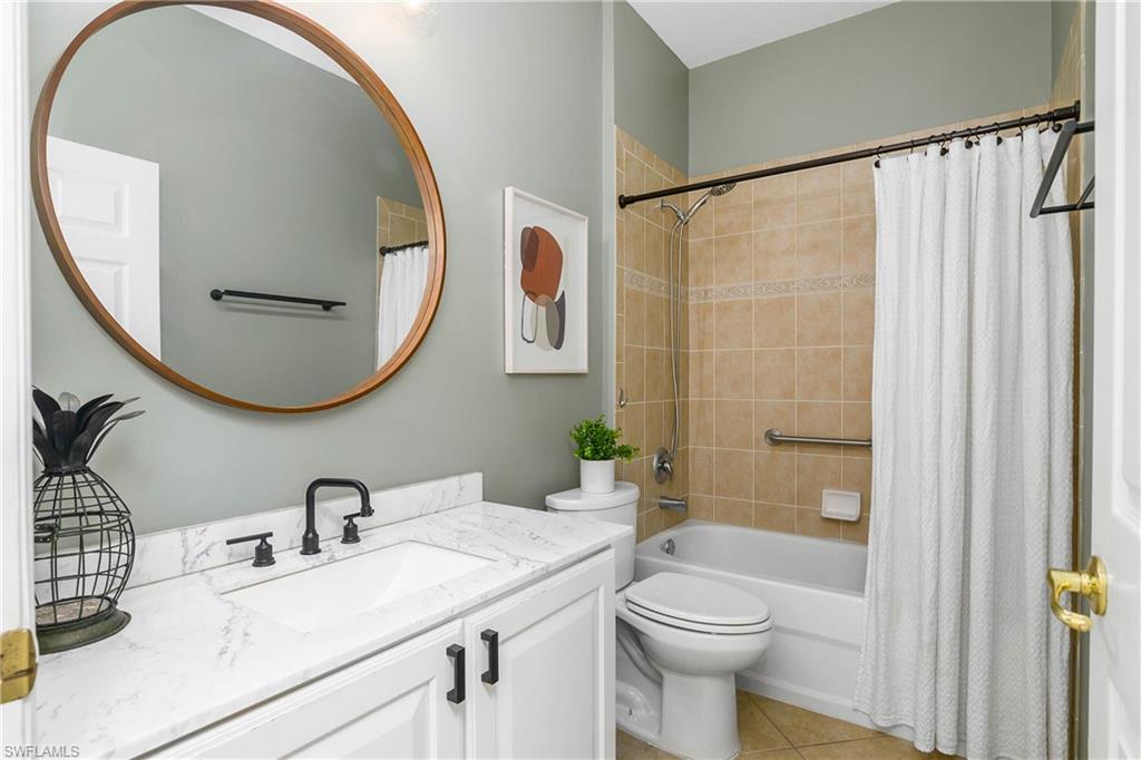 12454 Rock Ridge Lane Fort Myers, FL 33913 - Photo 18 of 37 a bathroom with a sink and a mirror