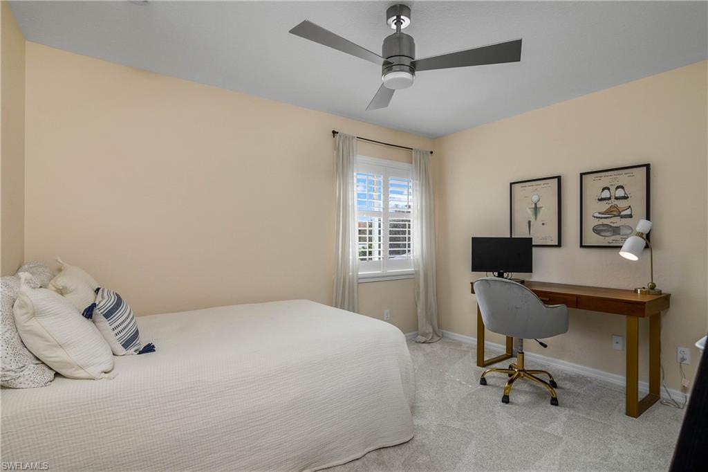 12454 Rock Ridge Lane Fort Myers, FL 33913 - Photo 21 of 37 a bedroom with a workspace