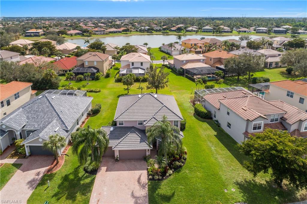 12454 Rock Ridge Lane Fort Myers, FL 33913 - Photo 27 of 37 an aerial view of residential houses with outdoor space