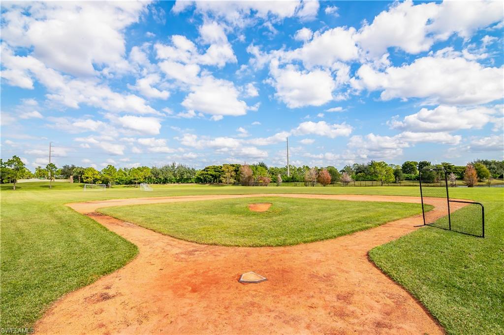 12454 Rock Ridge Lane Fort Myers, FL 33913 - Photo 35 of 37 a view of a lake with a big yard