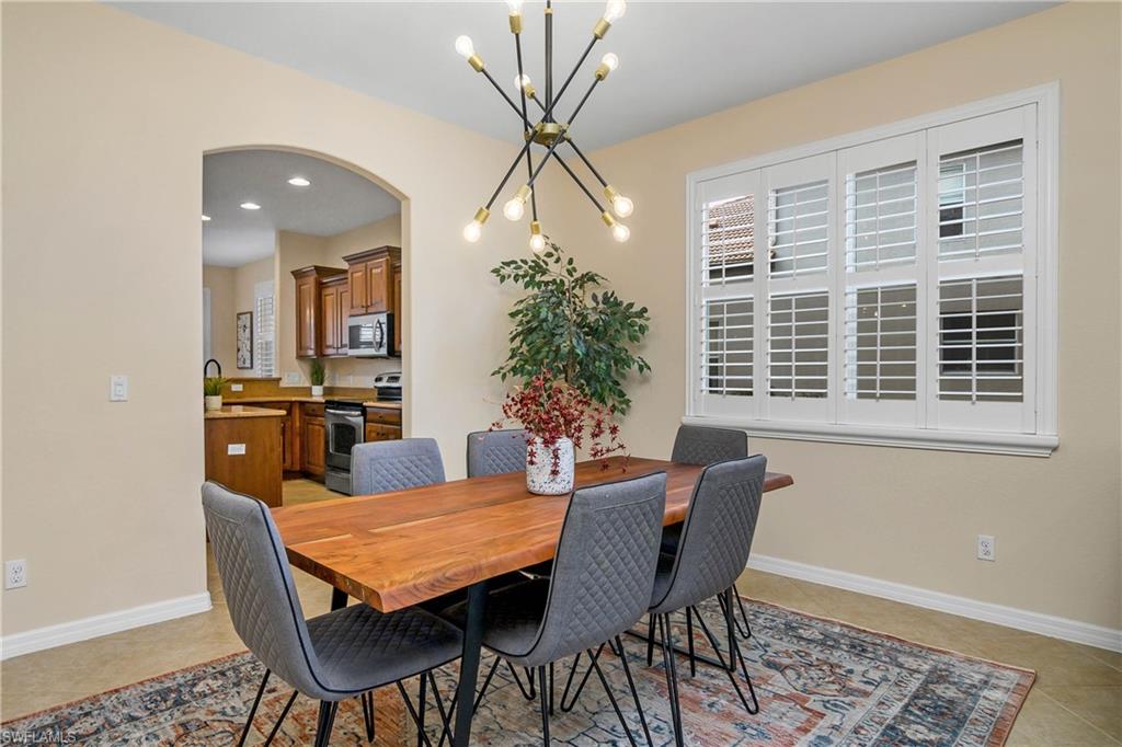 12454 Rock Ridge Lane Fort Myers, FL 33913 - Photo 4 of 37 a view of a dining room with furniture and window