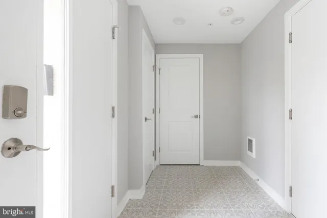 a bathroom with a sink a toilet a mirror and bathtub