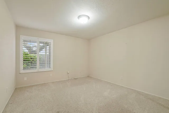an empty room with closet area
